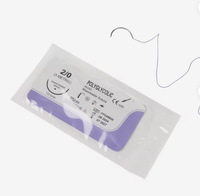Close-up of an absorbable polyglycolic acid surgical suture package