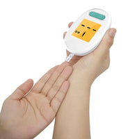 Blood glucose meter being used with a test strip